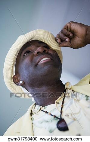 Close-up of a mature man tipping his hat View Large Photo Image Stock Image - Close-up of a mature man tipping his hat. Fotosearch