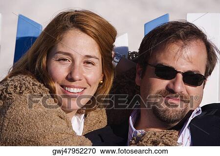 Close-up of a mid adult couple smiling View Large Photo Image Stock Image - Close-up of a mid adult couple smiling. Fotosearch