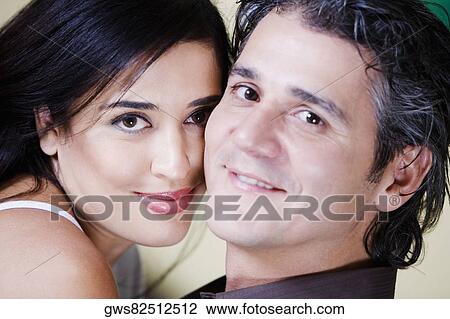 Close-up of a mid adult couple smiling View Large Photo Image Stock Image - Close-up of a mid adult couple smiling. Fotosearch