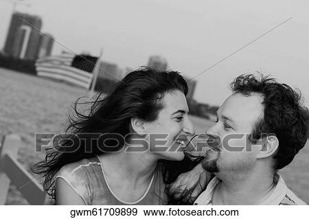 Stock Photo - Close-up of a mid adult couple smiling. Fotosearch