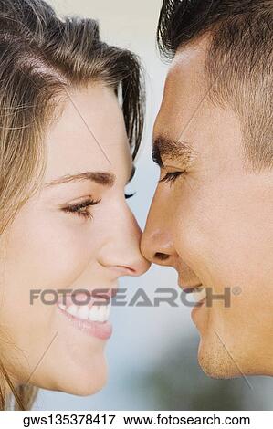 Close-up of a mid adult couple smiling View Large Photo Image Stock Photo - Close-up of a mid adult couple smiling. Fotosearch