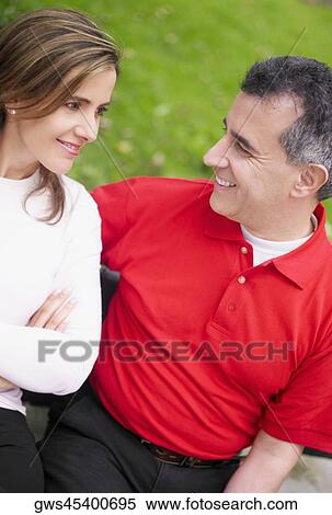 Close-up of a mid adult couple smiling View Large Photo Image Stock Photography - Close-up of a mid adult couple smiling. Fotosearch