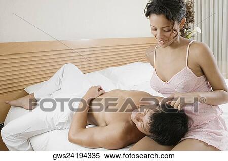 Close-up of a mid adult man lying on a teenage girl's lap and smiling View Large Photo Image Stock Photography - Close-up of a mid adult man lying on a teenage girl's lap and smiling. Fotosearch