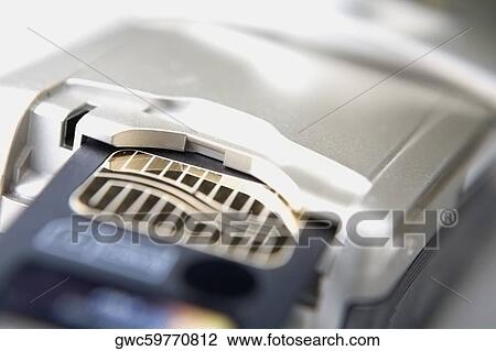 Close-up of a mobile phone and a memory card View Large Photo Image Stock Image - Close-up of a mobile phone and a memory card. Fotosearch