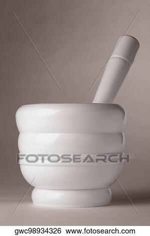 Close-up of a mortar and a pestle View Large Photo Image Stock Photograph - Close-up of a mortar and a pestle. Fotosearch