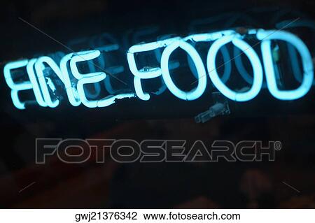 Close-up of a neon sign lit up at night View Large Photo Image Stock Image - Close-up of a neon sign lit up at night. Fotosearch