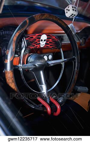 Stock Photo - Close-up of a padlock on a steering wheel. Fotosearch