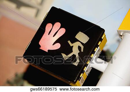 Close-up of a pedestrian crossing sign View Large Photo Image Stock Photography - Close-up of a pedestrian crossing sign. Fotosearch