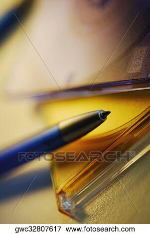Close-up of a pen on a CD case View Large Photo Image Stock Photo - Close-up of a pen on a CD case. Fotosearch