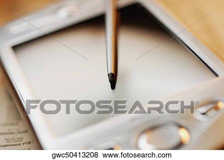 Close-up of a personal data assistant with a digitized pen View Large Photo Image Stock Photo - Close-up of a personal data assistant with a digitized pen. Fotosearch