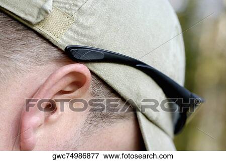 Close-up of a person's ear View Large Photo Image Stock Photo - Close-up of a person's ear. Fotosearch
