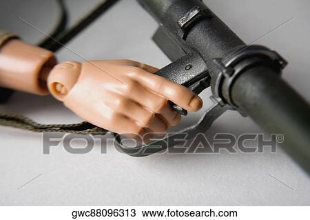 Close-up of a robot's hand holding a gun View Large Photo Image Stock Image - Close-up of a robot's hand holding a gun. Fotosearch