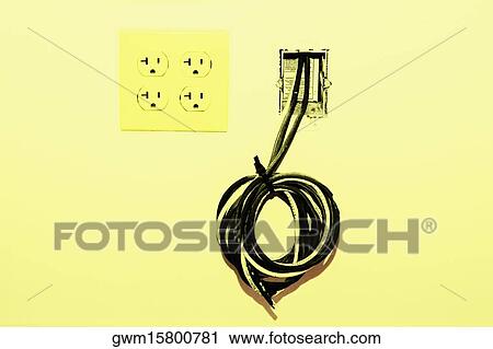 Close-up of a roll of cables coming out from a wall View Large Photo Image Stock Image - Close-up of a roll of cables coming out from a wall. Fotosearch