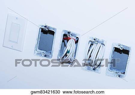 Close-up of a roll of cables coming out from a wall View Large Photo Image Stock Image - Close-up of a roll of cables coming out from a wall. Fotosearch