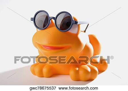 Close-up of a rubber frog wearing a pair of sunglasses View Large Photo Image Stock Photo - Close-up of a rubber frog wearing a pair of sunglasses. Fotosearch