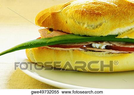 Close-up of a sandwich on a plate View Large Photo Image Stock Photography - Close-up of a sandwich on a plate. Fotosearch