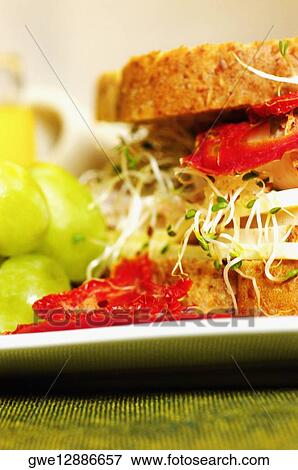 Close-up of a sandwich with grapes in a plate View Large Photo Image Stock Photo - Close-up of a sandwich with grapes in a plate. Fotosearch