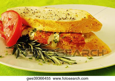 Close-up of a sandwich with tomato slices on a plate View Large Photo Image Stock Photography - Close-up of a sandwich with tomato slices on a plate. Fotosearch