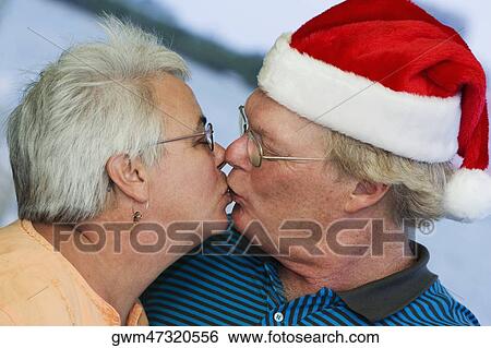 Stock Photograph - Close-up of a senior couple kissing each other. Fotosearch