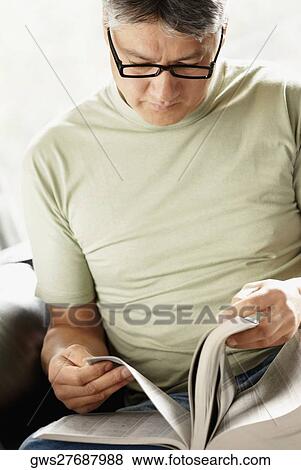 Close-up of a senior man reading a book View Large Photo Image Stock Photo - Close-up of a senior man reading a book. Fotosearch