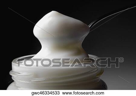 Close-up of a spoon in a jar full of mayonnaise View Large Photo Image Stock Image - Close-up of a spoon in a jar full of mayonnaise. Fotosearch