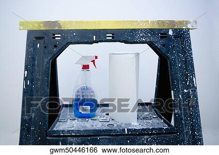 Close-up of a spray bottle with tissue papers on a step ladder View Large Photo Image Stock Photograph - Close-up of a spray bottle with tissue papers on a step ladder. Fotosearch