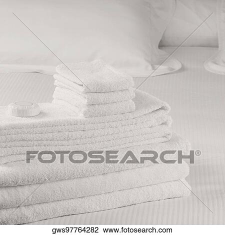 Close-up of a stack of towels on the bed View Large Photo Image Stock Image - Close-up of a stack of towels on the bed. Fotosearch