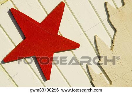 Close-up of a star shape on a wooden surface View Large Photo Image Stock Photograph - Close-up of a star shape on a wooden surface. Fotosearch