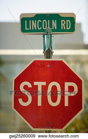 Close-up of a stop sign and a street name sign View Large Photo Image Stock Photo - Close-up of a stop sign and a street name sign. Fotosearch