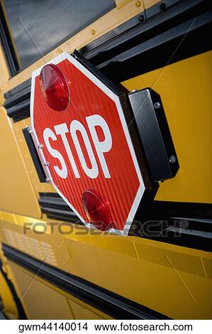 Picture - Close-up of a stop sign on a school bus. Fotosearch