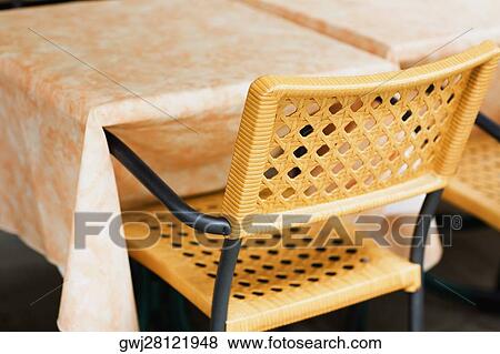 Close-up of a table and a chair View Large Photo Image Stock Photo - Close-up of a table and a chair. Fotosearch