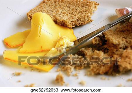 Close-up of a table knife with brown bread and cheese View Large Photo Image Stock Image - Close-up of a table knife with brown bread and cheese. Fotosearch