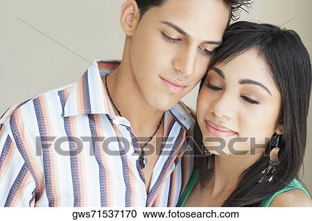 Close-up of a teenage girl and a young man View Large Photo Image Stock Image - Close-up of a teenage girl and a young man. Fotosearch
