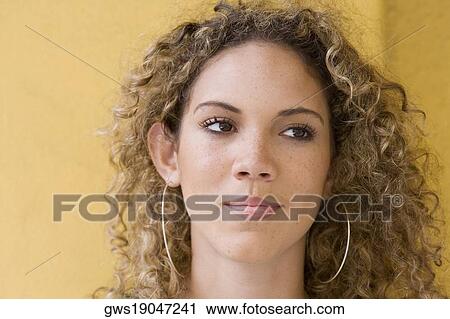 Stock Image - Close-up of a teenage girl looking away. Fotosearch