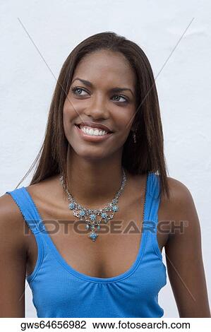Stock Image - Close-up of a teenage girl smiling. Fotosearch