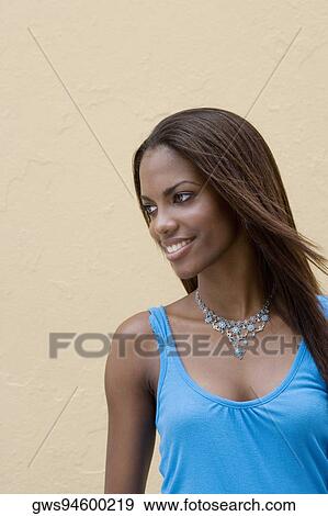 Stock Photo - Close-up of a teenage girl smiling. Fotosearch