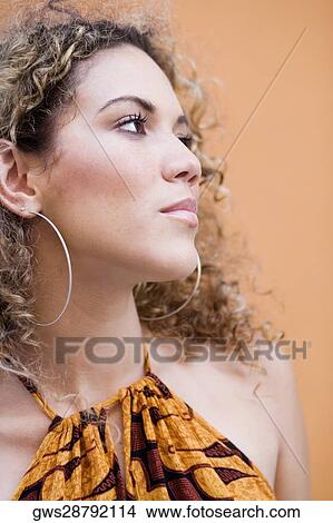 Close-up of a teenage girl thinking View Large Photo Image Picture - Close-up of a teenage girl thinking. Fotosearch