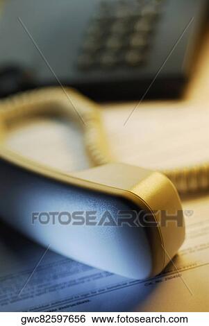 Close-up of a telephone on a sheet of paper View Large Photo Image Stock Photograph - Close-up of a telephone on a sheet of paper. Fotosearch