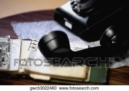 Close-up of a telephone on the table View Large Photo Image Stock Image - Close-up of a telephone on the table. Fotosearch