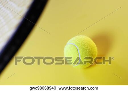 Close-up of a tennis ball and a tennis racket View Large Photo Image Stock Image - Close-up of a tennis ball and a tennis racket. Fotosearch
