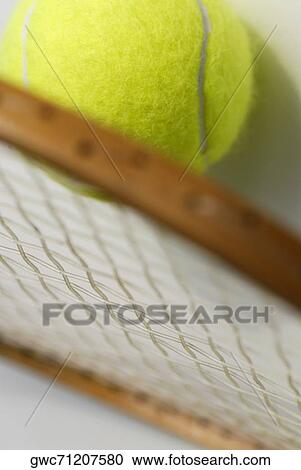 Close-up of a tennis ball with a tennis racket View Large Photo Image Stock Image - Close-up of a tennis ball with a tennis racket. Fotosearch