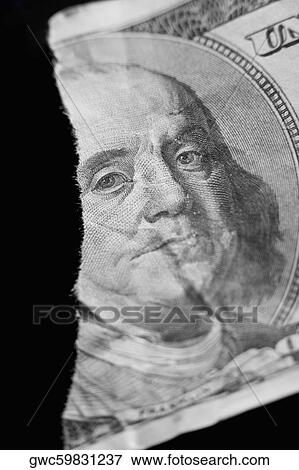 Stock Photo - Close-up of a torn bank note. Fotosearch