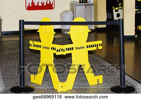 Close-up of a warning sign with a barricade View Large Photo Image Stock Photograph - Close-up of a warning sign with a barricade. Fotosearch
