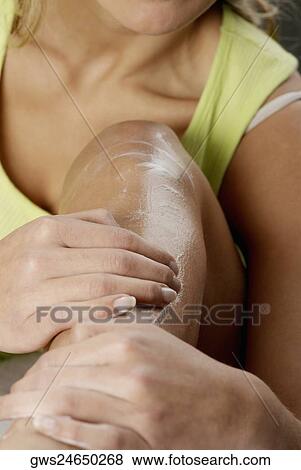 Close-up of a woman applying hair removing cream on her leg View Large Photo Image Stock Photo - Close-up of a woman applying hair removing cream on her leg. Fotosearch