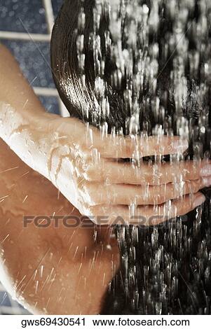 Close-up of a woman in the shower View Large Photo Image Stock Image - Close-up of a woman in the shower. Fotosearch