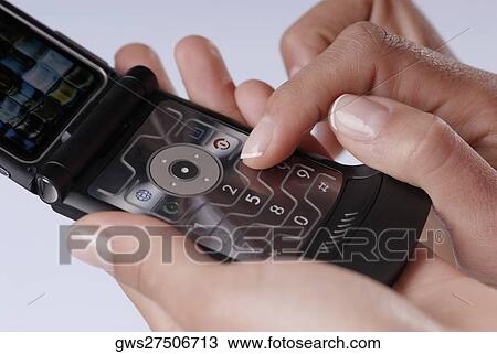 Close-up of a woman's finger using a mobile phone View Large Photo Image Stock Image - Close-up of a woman's finger using a mobile phone. Fotosearch