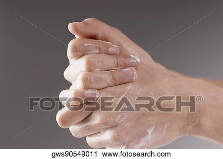Close-up of a woman's hand applying moisturizer View Large Photo Image Stock Image - Close-up of a woman's hand applying moisturizer. Fotosearch