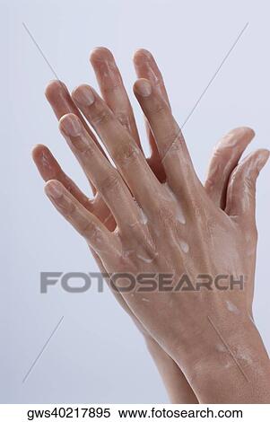 Close-up of a woman's hand applying moisturizer View Large Photo Image Stock Photography - Close-up of a woman's hand applying moisturizer. Fotosearch