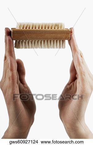 Close-up of a woman's hand holding a make-up brush View Large Photo Image Picture - Close-up of a woman's hand holding a make-up brush. Fotosearch