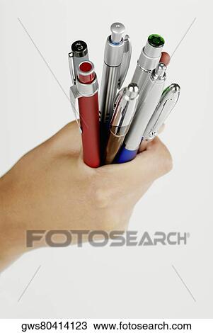 Close-up of a woman's hand holding pens View Large Photo Image Stock Image - Close-up of a woman's hand holding pens. Fotosearch